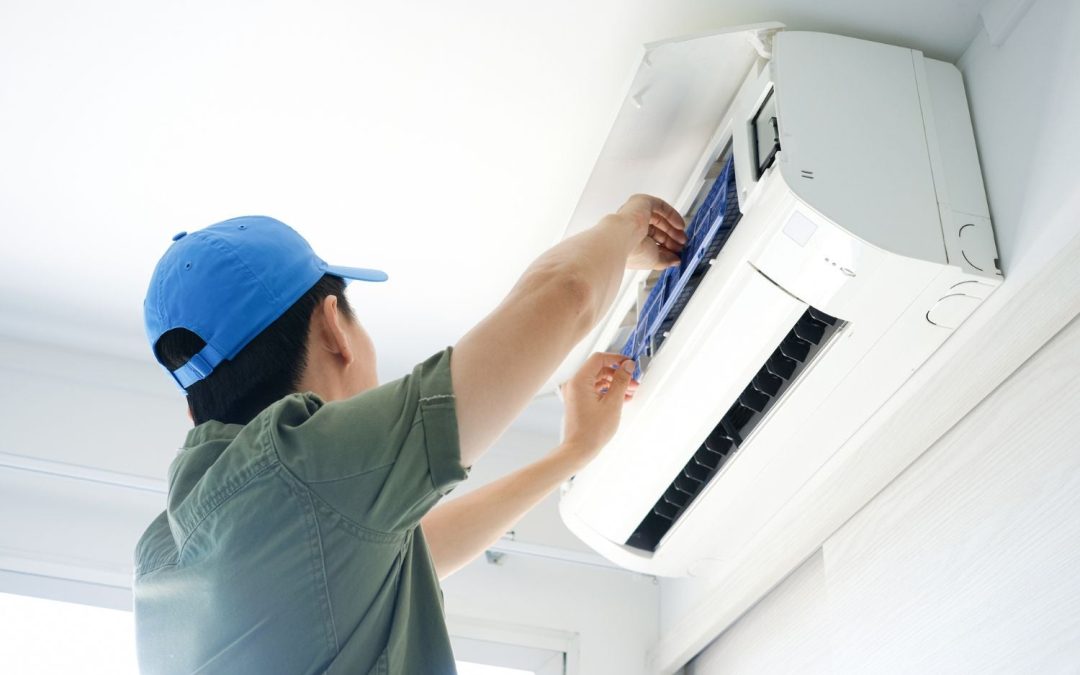 HVAC technician servicing a ductless mini split in Newark